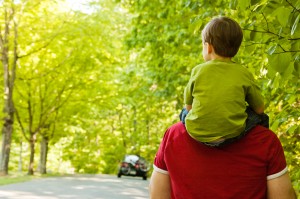 Boy riding Dad's shoulders