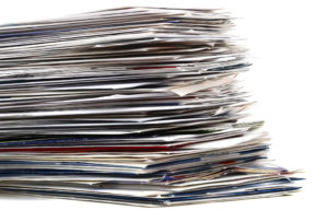 A photo of a stack of mail.