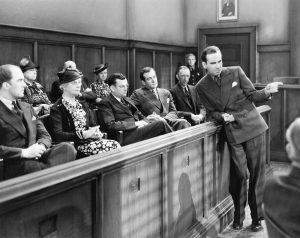 A black-and-white photo of a Caucasian jury.