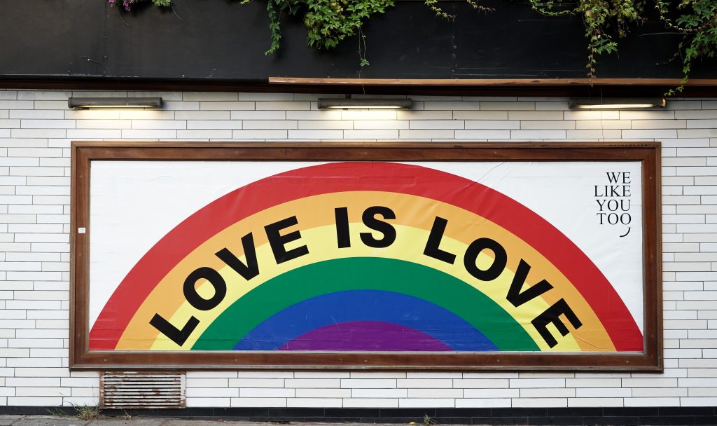 a painting with the words "love is love"